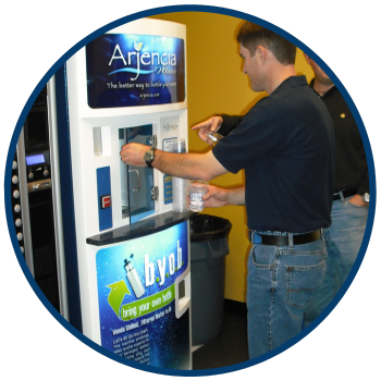 men using a water vending machine image
